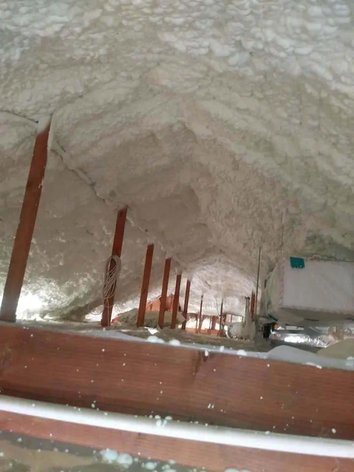 Spray foam insulation at a cathedral attic roof deck