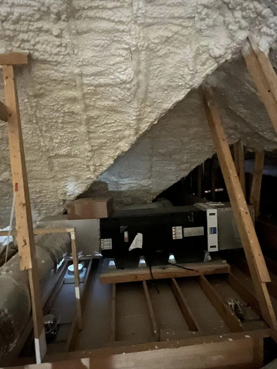 Roofline foam coverage in a Virginia attic