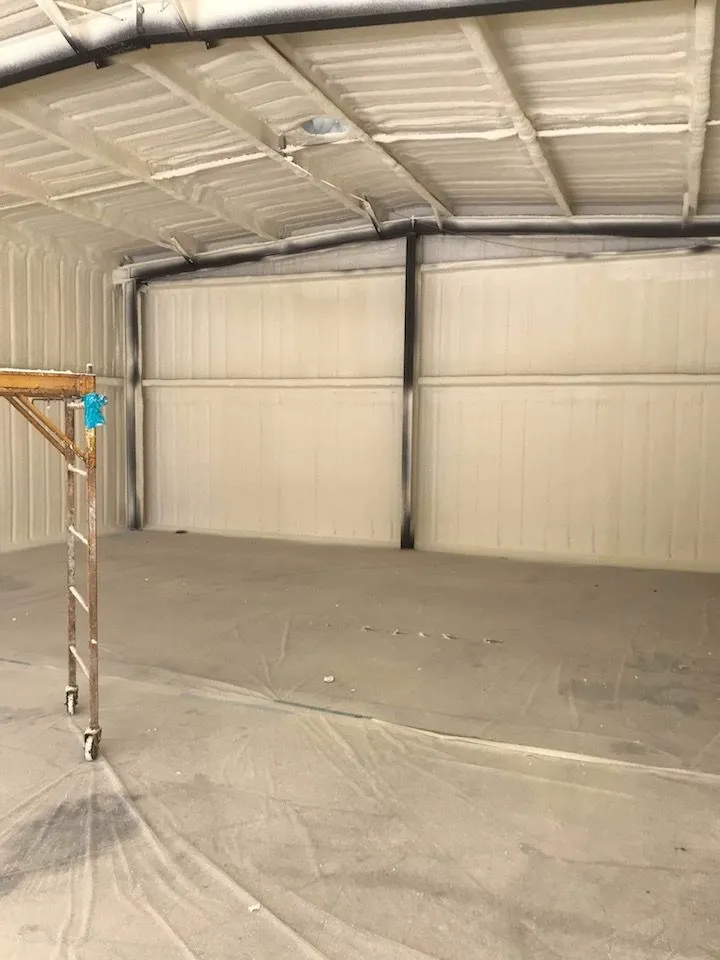 Metal building interior insulated with spray foam